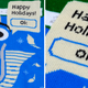 Close-up details of the Microsoft ugly holiday sweater featuring Clippy.